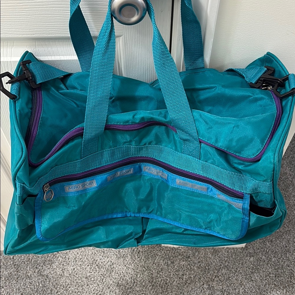 Aero Sport Teal Duffel Bag with Purple Accents